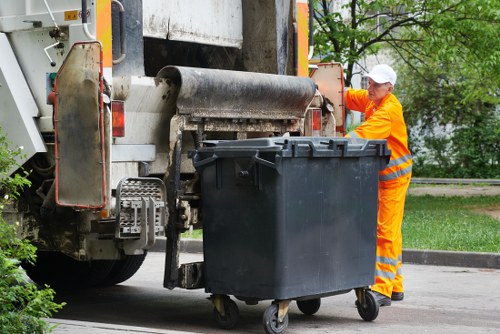 Staff reviewing waste collection records during an investigation